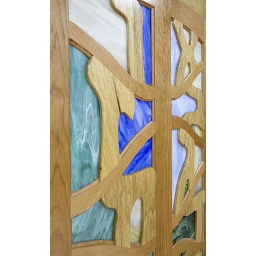 detail of stained glass inset into wood doors