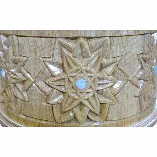 carving in solid wood with glass inlays