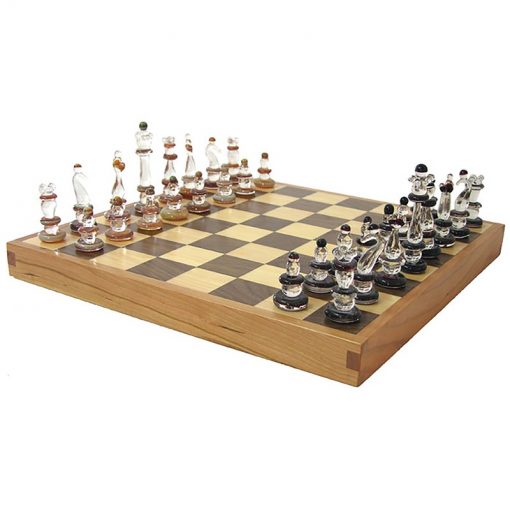 glass chess pieces and hardwood chess board