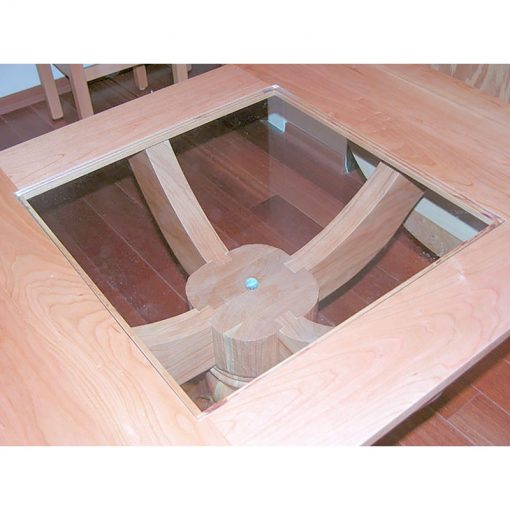 glass table top on cherry wood pedestal table