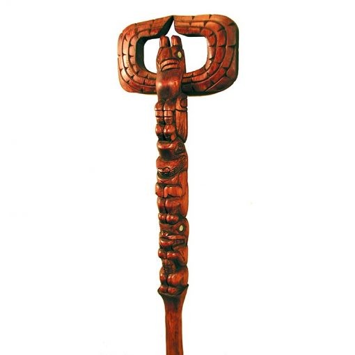 Carved wood talking stick in northwest coast style